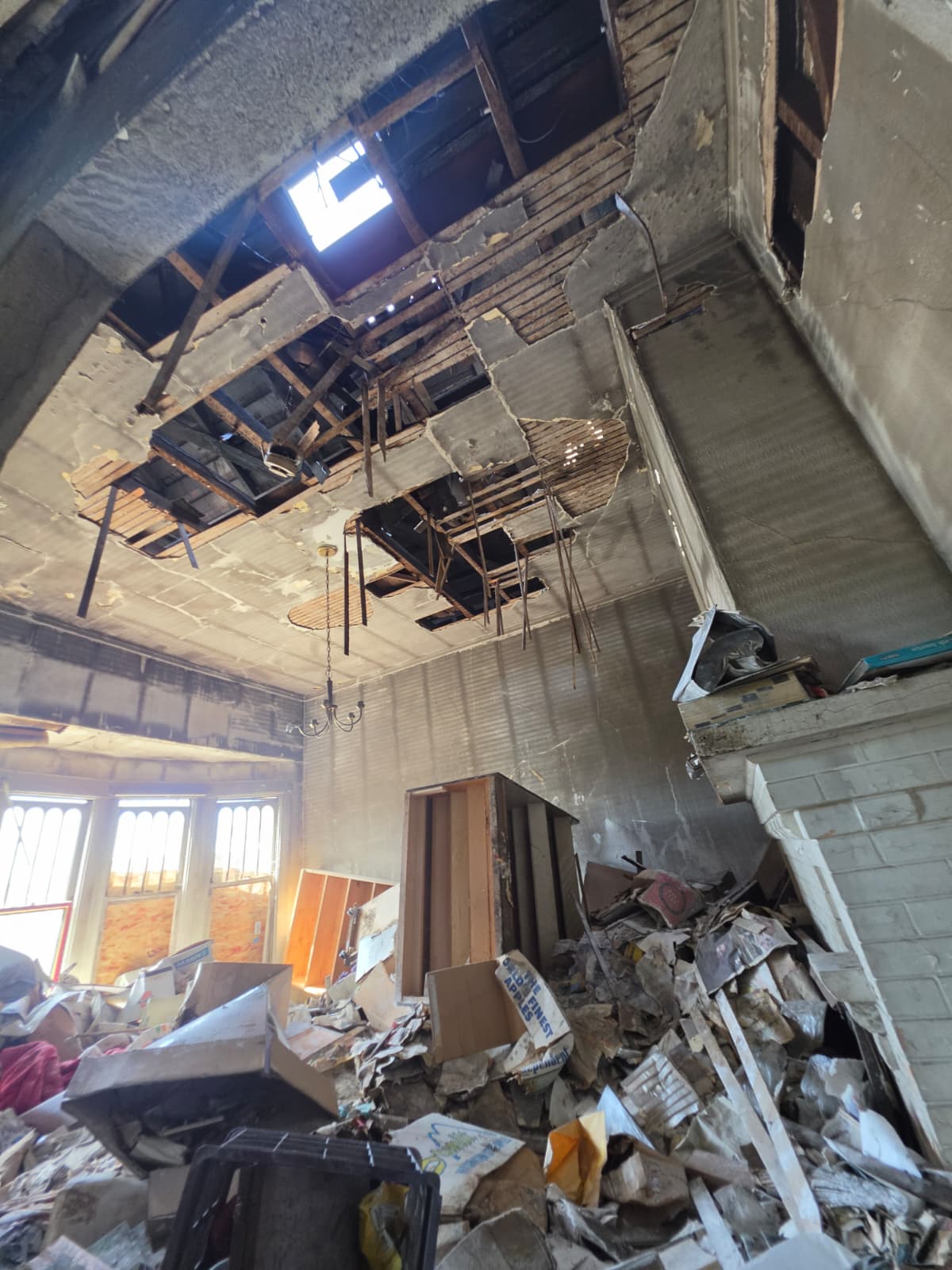 Hole in the roof of a fire damaged Victorian home in Oceanview, San Francisco